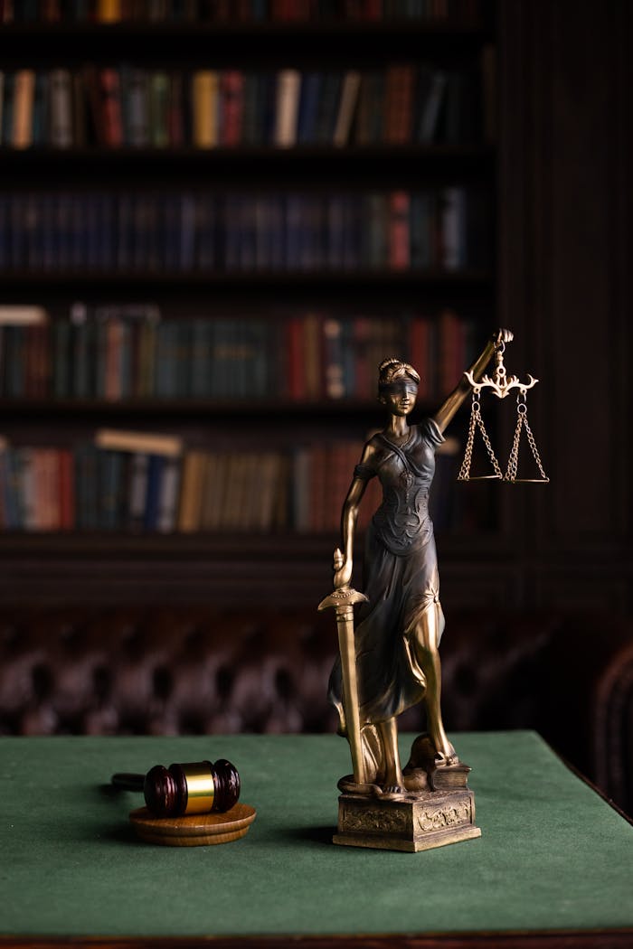 Mastering the First Impression: Your intriguing post title goes here Lady Justice and gavel on a table in a classic law library setting.